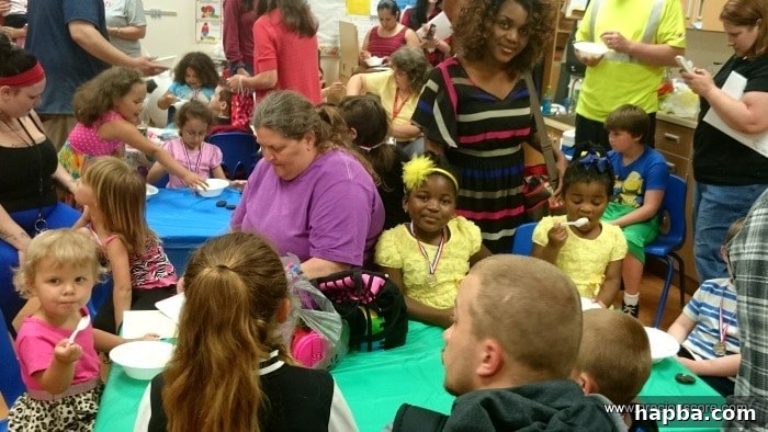 Children enjoying ice cream after their school performance.