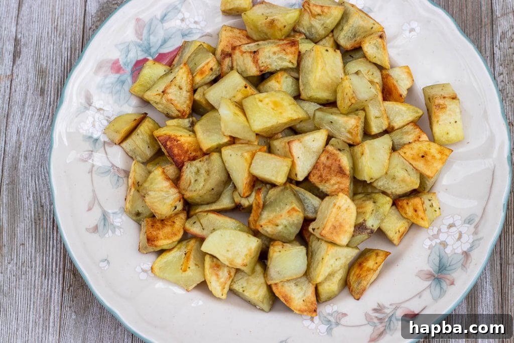 Crispy Oven Potatoes 3 oven roasted potatoes on a serving platter