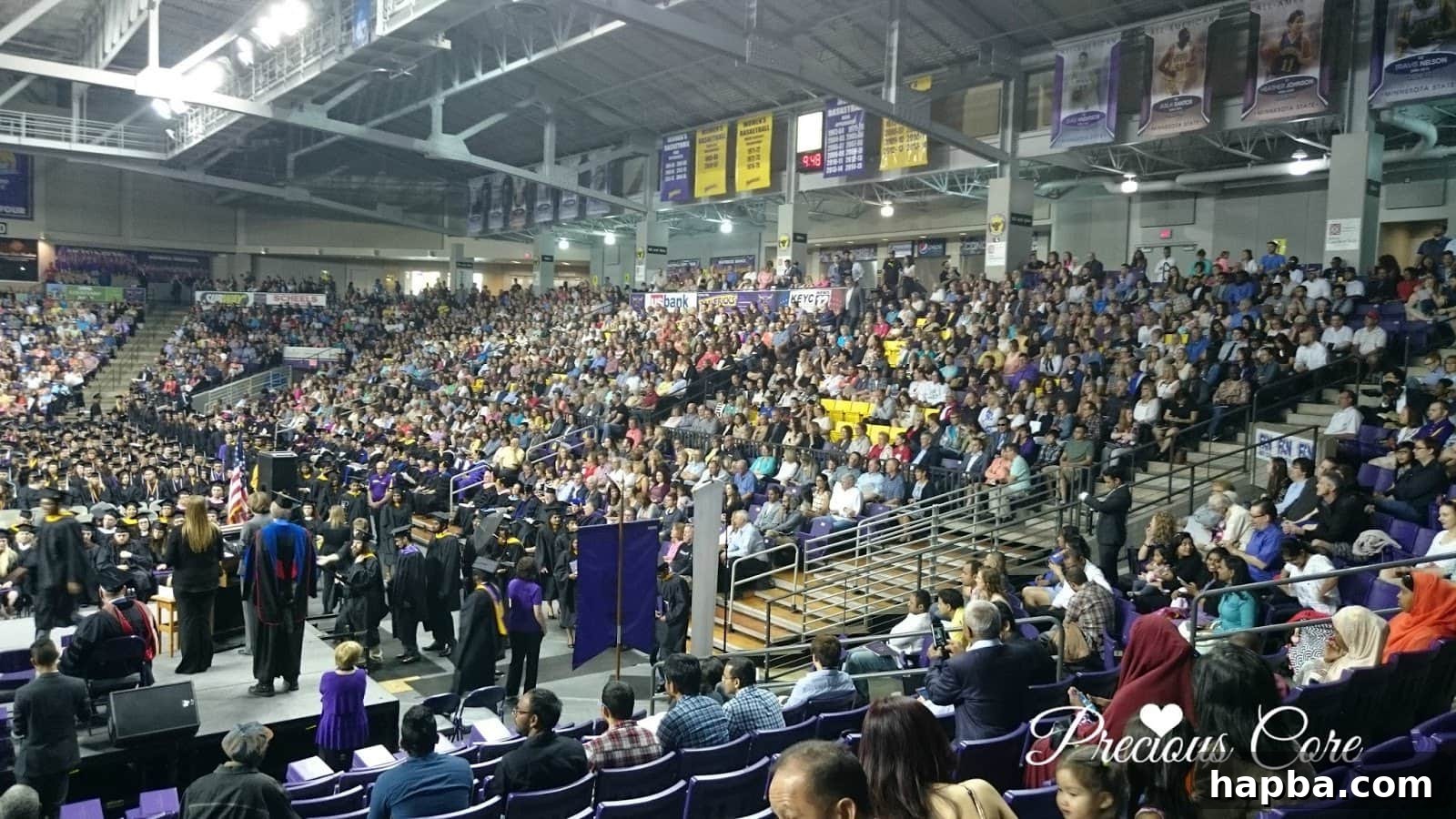 The Week's Party Forecast 4 An expansive interior view of the graduation hall, filled with attendees and beaming with celebratory energy.