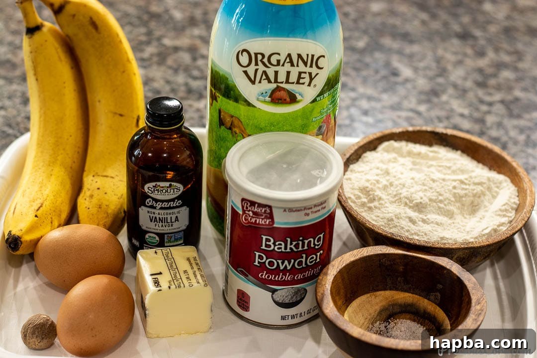 A beautifully arranged flat lay photo showcasing all the fresh ingredients needed to make delicious banana pancakes.