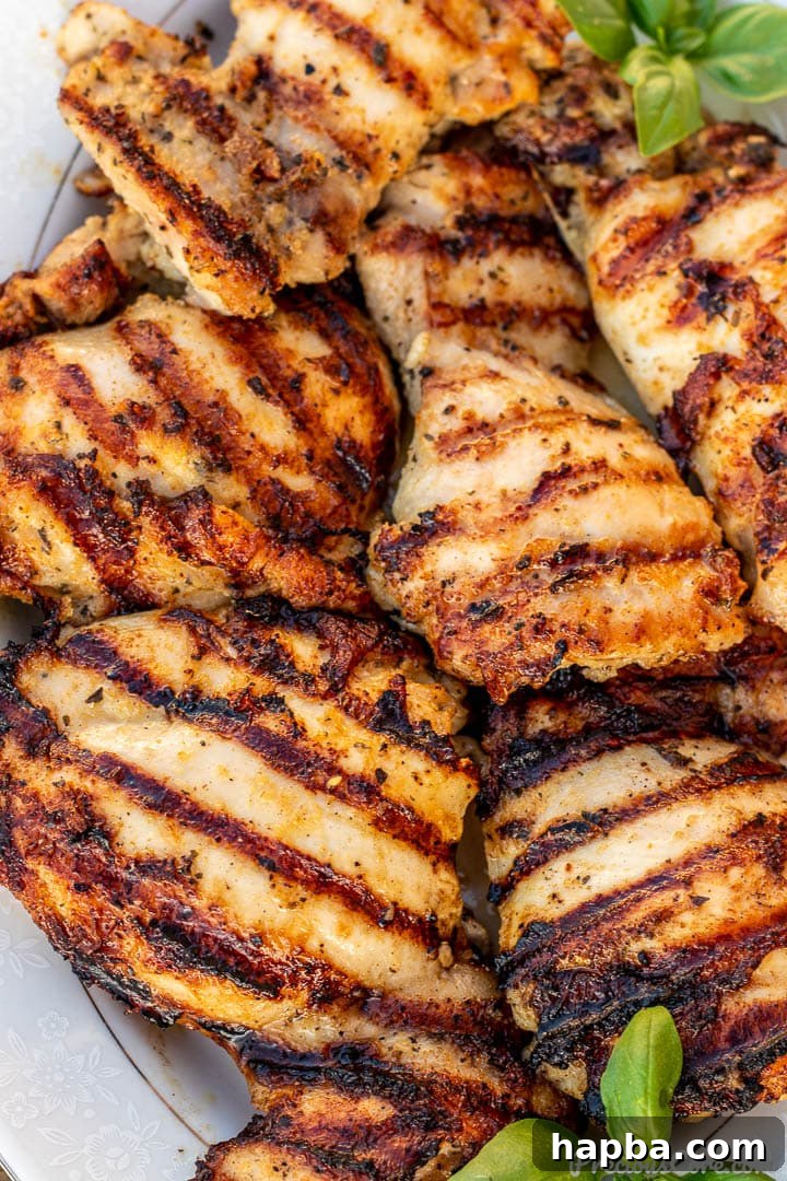 Close-up of perfectly charred grilled chicken thighs