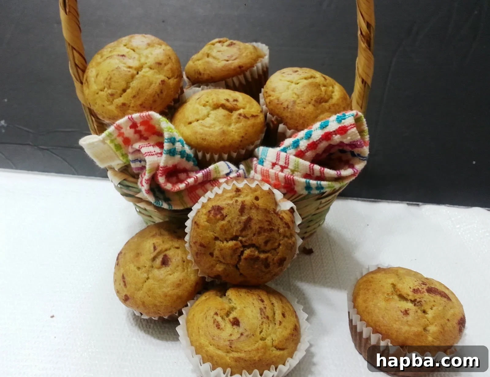 A charming basket filled with golden-brown Cameroonian banana cakes, perfectly baked and ready to enjoy.