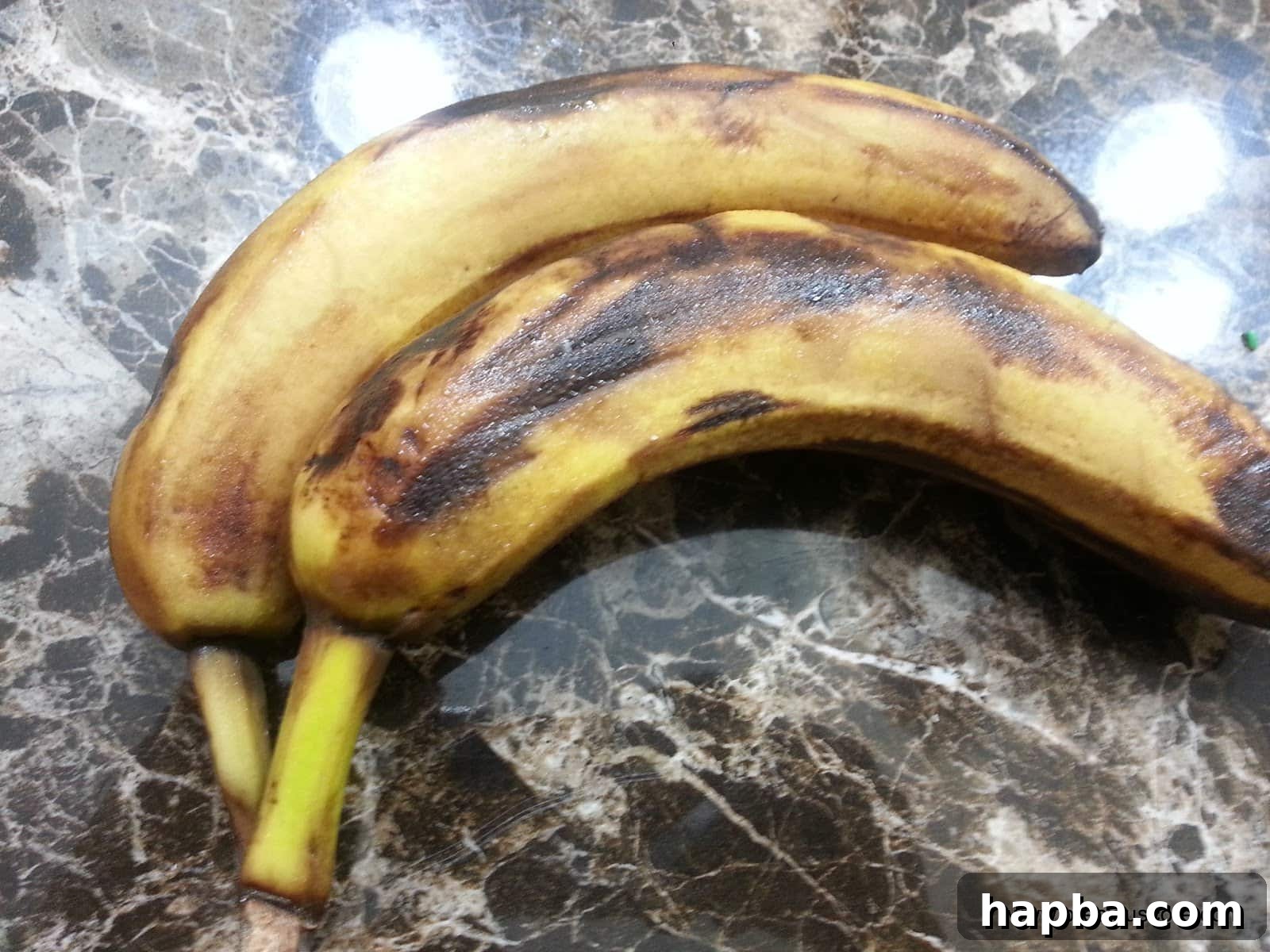 Close-up of overripe bananas with dark brown spots, ideal for baking.