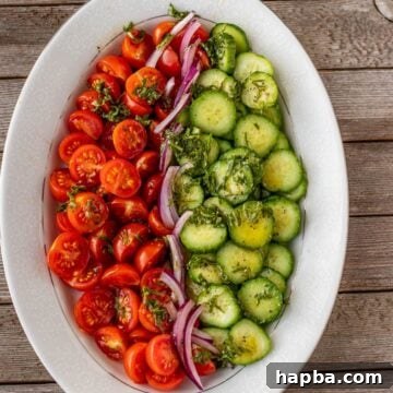 Vibrant Cucumber, Tomato, and Onion Medley 8 tomato cucumber salad on a platter