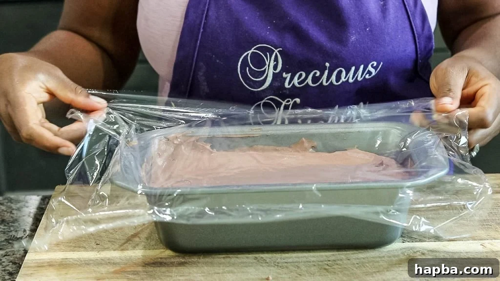 Covering ice cream mixture with plastic wrap