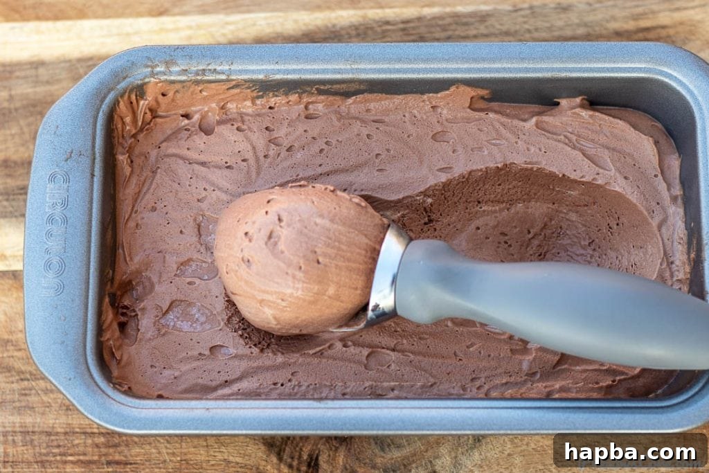 Scoop of ice cream in loaf pan filled with ice cream
