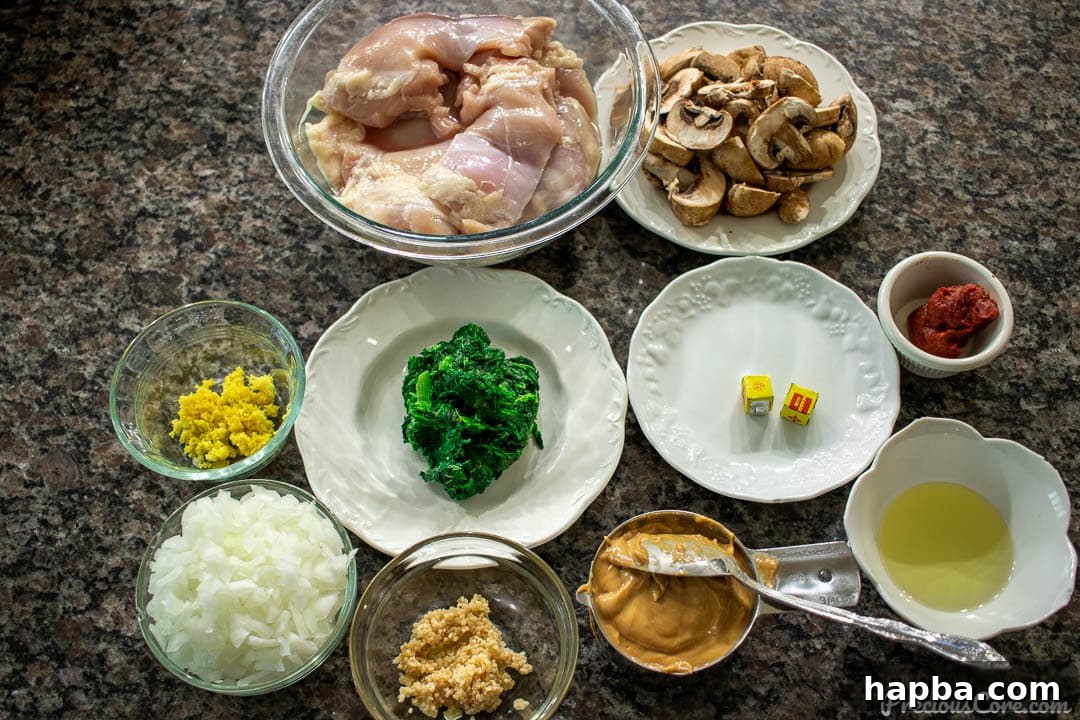 West African Groundnut Chicken Stew 4 Ingredients needed for easy African chicken peanut stew laid out on a countertop.