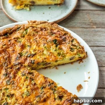 Easy Quiche on a white plate, ready to be served.