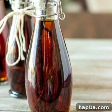 Homemade vanilla extract in bottles, with vanilla beans visible.