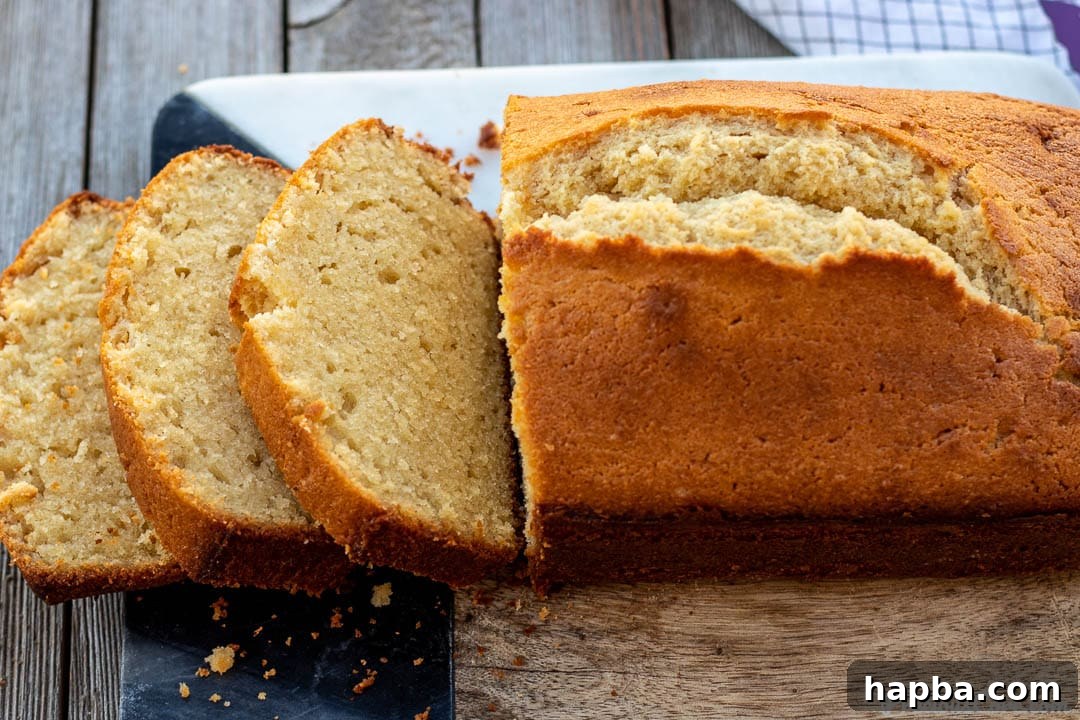 Pound Cake on cutting board with some slices.