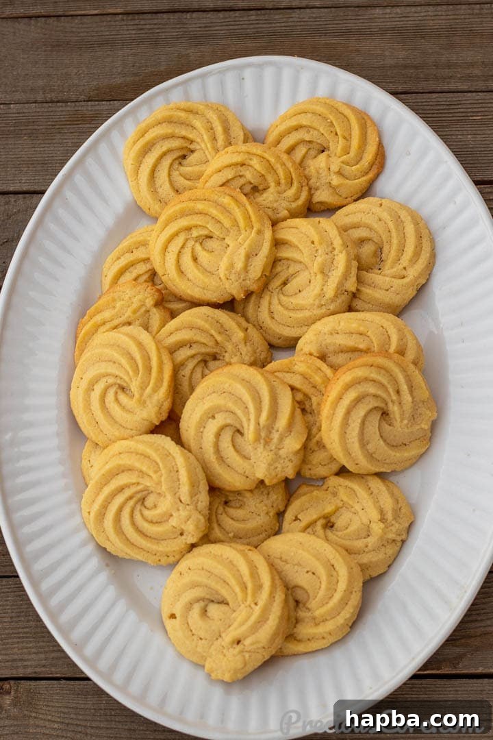 A beautiful platter of freshly baked Danish Butter Cookies, golden and perfectly shaped.