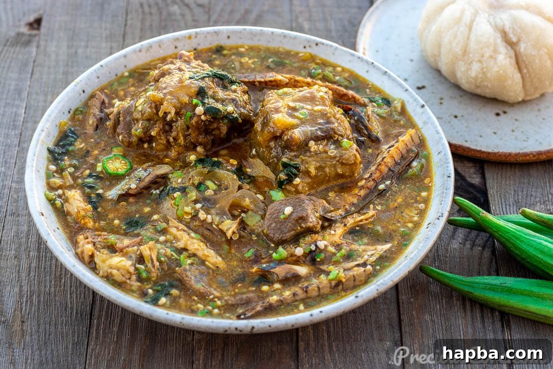 Vibrant African Okra Soup 3 A beautiful landscape shot featuring a bowl of African Okra Soup alongside a portion of fufu, showcasing a traditional African meal.