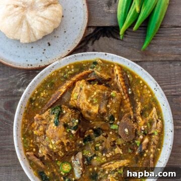 Vibrant African Okra Soup 7 A bowl of African Okra Soup with a plate of Garri fufu on the side