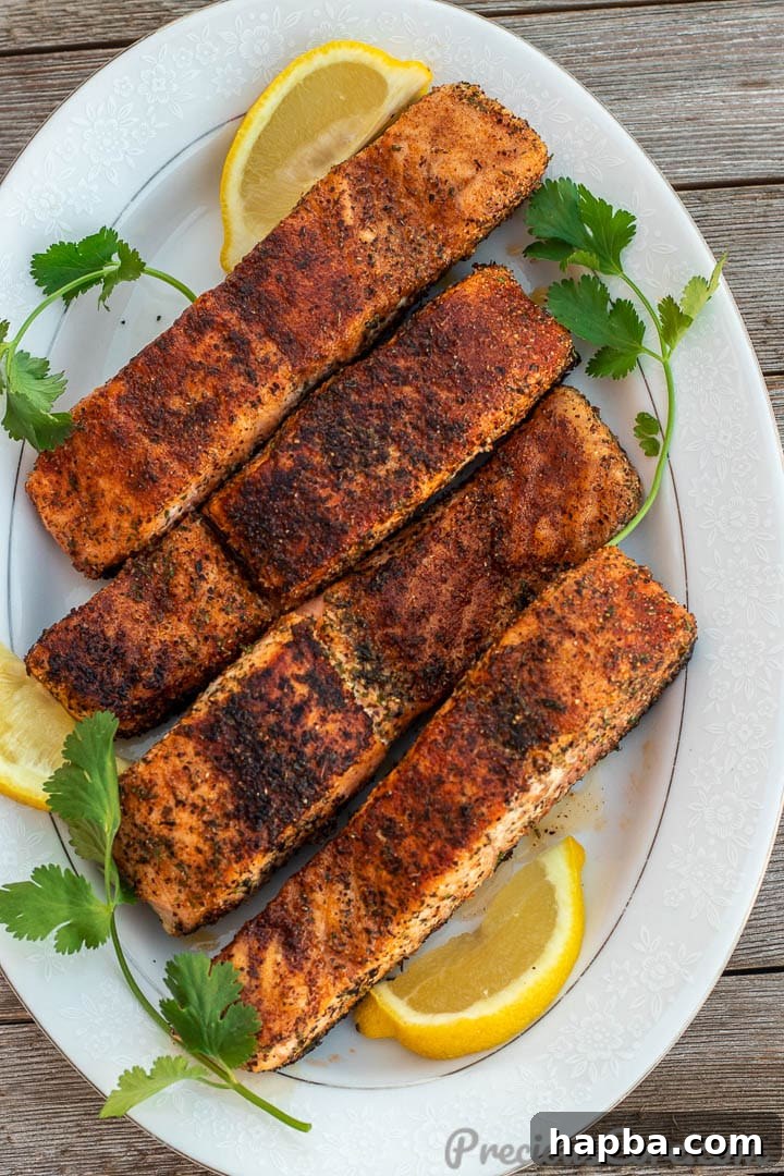 Golden Pan Seared Salmon 10 A platter brimming with perfectly pan-grilled salmon fillets, showcasing their golden-brown crust and inviting appearance.