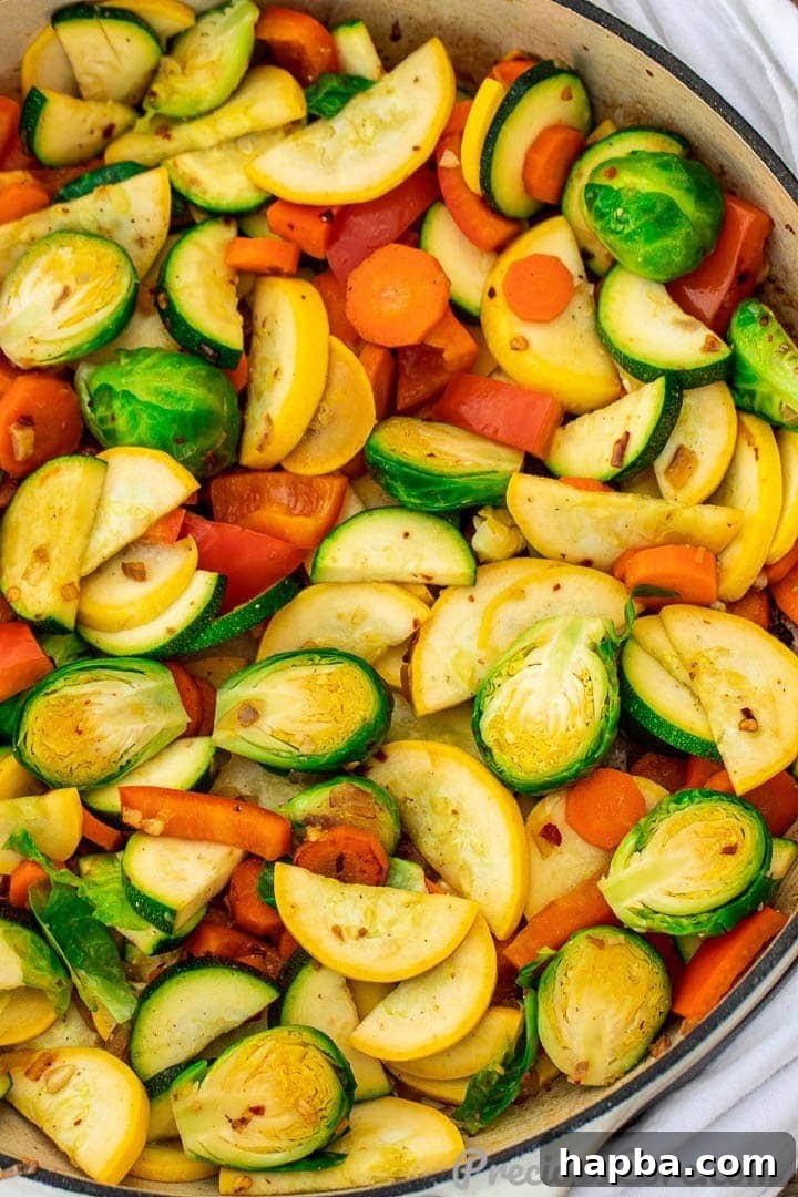 Sautéed vegetables in a braiser, showcasing a colorful and appetizing mix of fresh produce