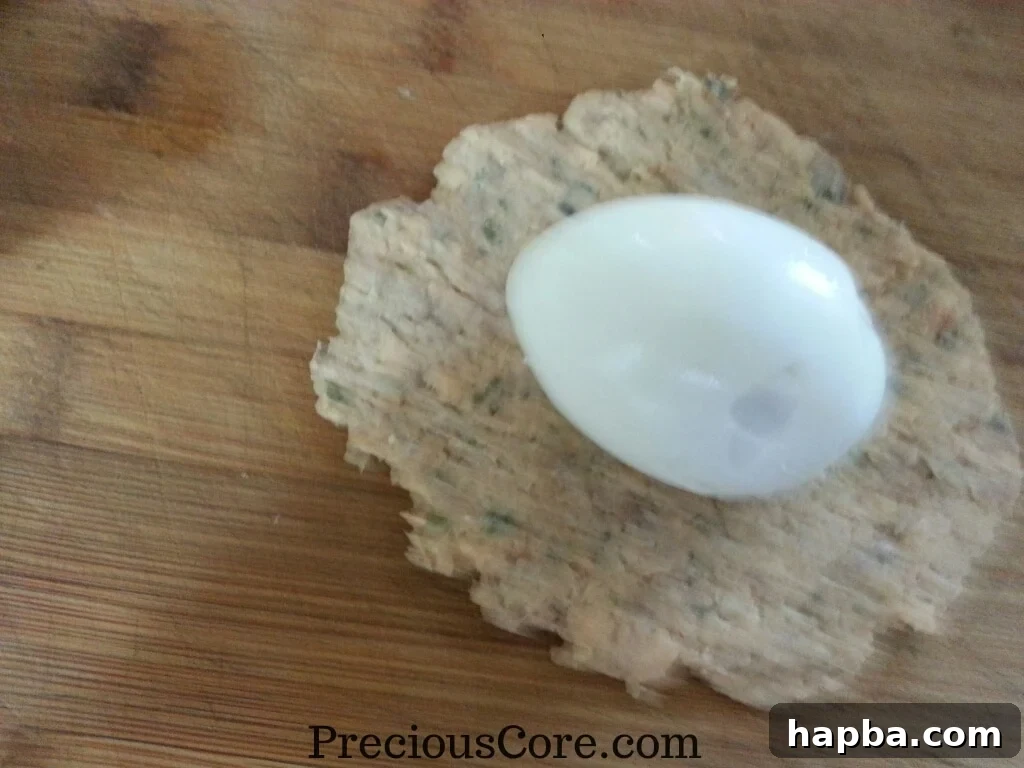 Hard-boiled egg placed on the fish mixture