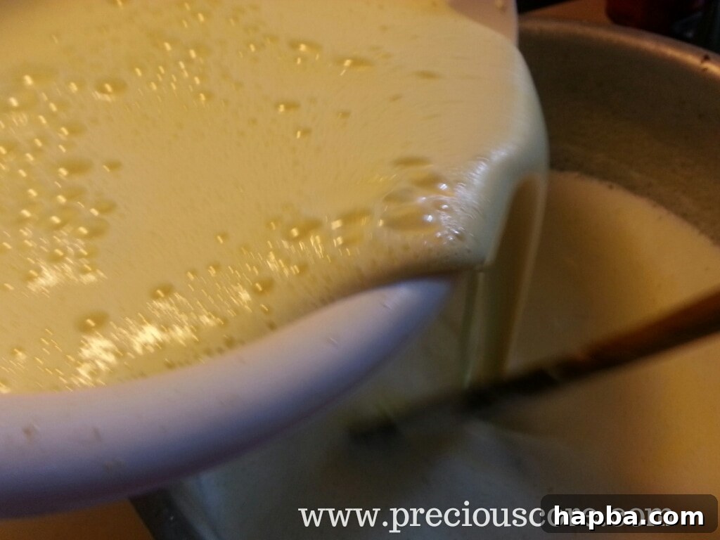 Tempered egg mixture added to hot dairy