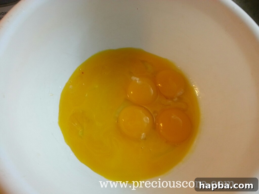 Eight egg yolks in a bowl