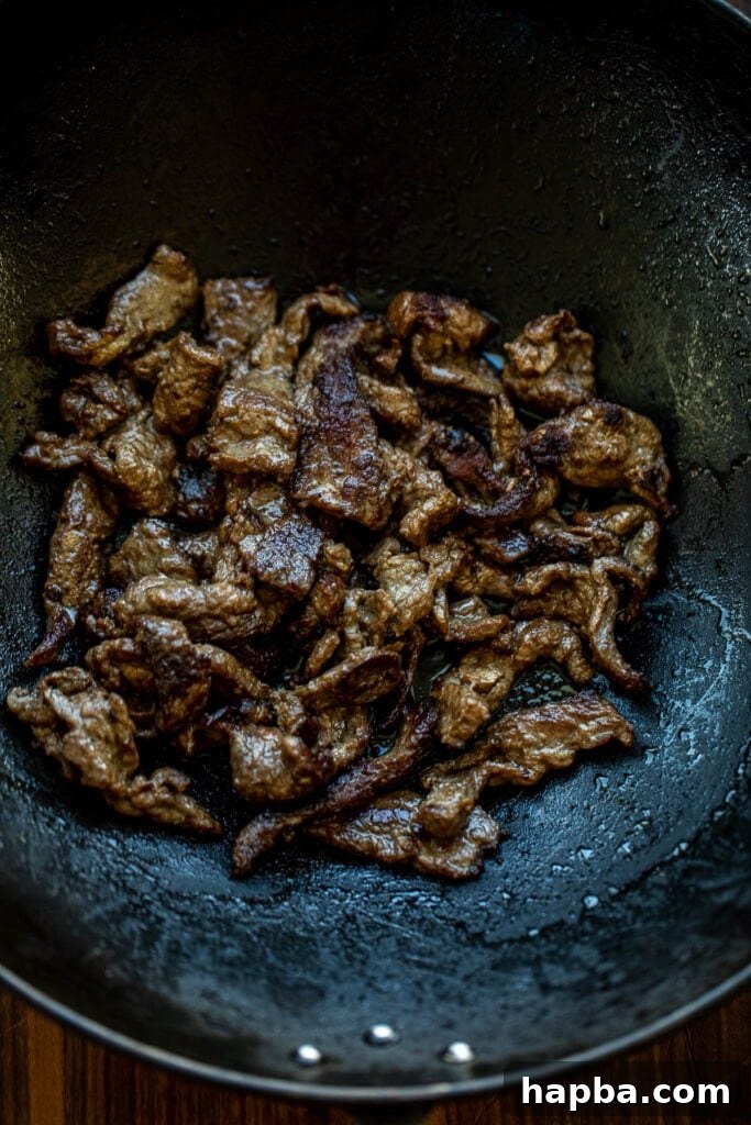 Seared Beef in Wok, cooking quickly at high heat