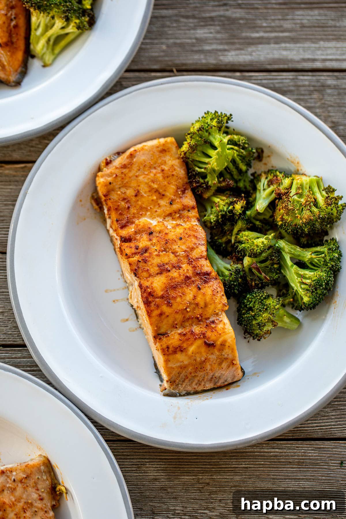 Effortless Sheet Pan Salmon and Broccoli 7 Close-up of a plate of baked salmon and broccoli from a sheet pan