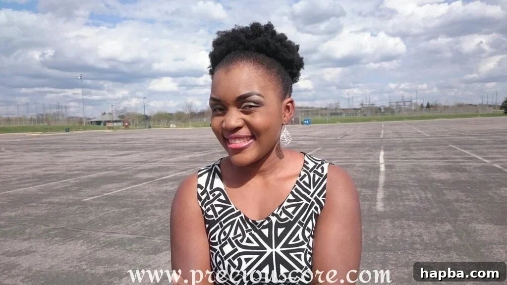 A woman's natural hair, appearing full and healthy, showing its current length.