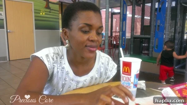 A woman with an extremely short buzz cut, reflecting her 'big chop' experience.