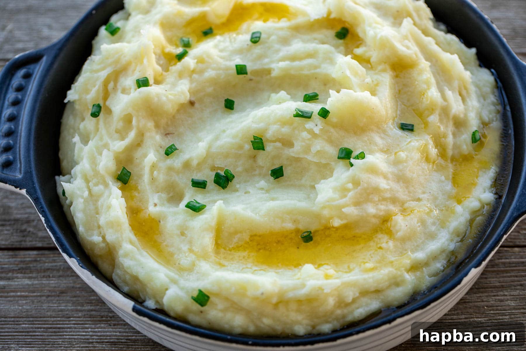 Velvety Buttermilk Mash 3 Landscape picture of buttermilk mashed potatoes in a serving bowl.