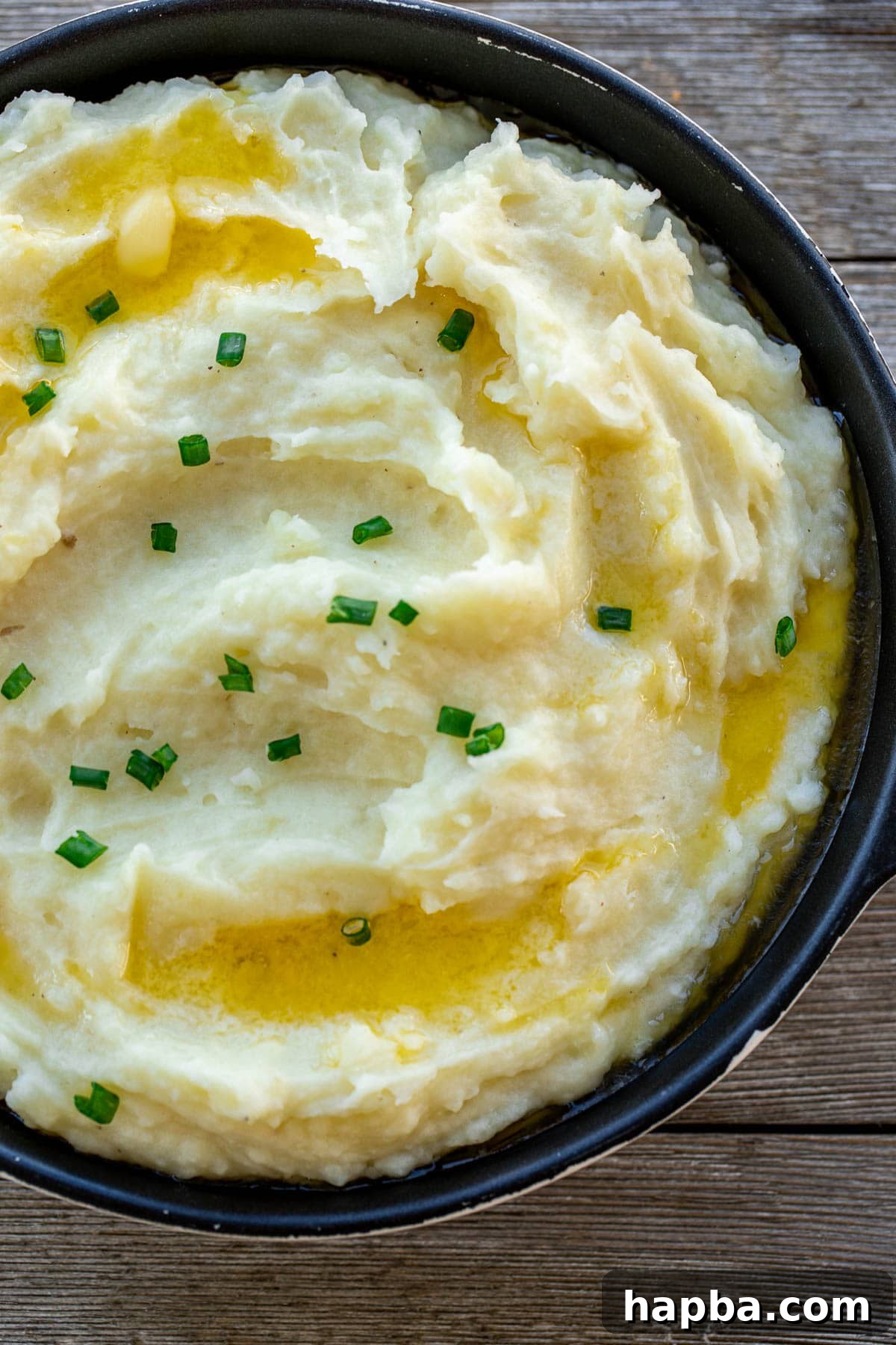 Velvety Buttermilk Mash 6 Buttermilk Mashed Potatoes topped with chopped green onions as a garnish.
