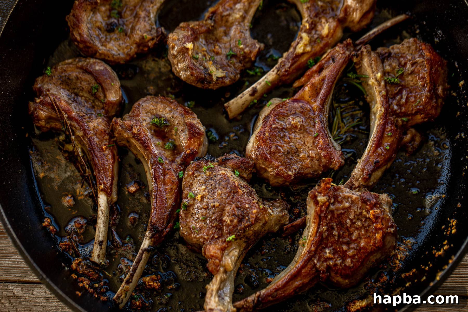 A delicious landscape photo of perfectly cooked lamb chops, beautifully arranged and ready to be served.