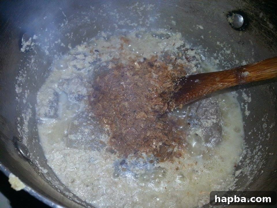 Crafting Delicious Okra Egusi Soup 6 Ground crayfish added to the simmering Egusi soup