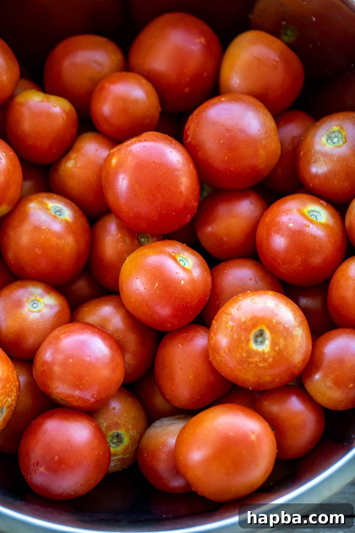 Artisan Homemade Tomato Paste 4 A vibrant pile of fresh, ripe red tomatoes, ideal for making homemade paste