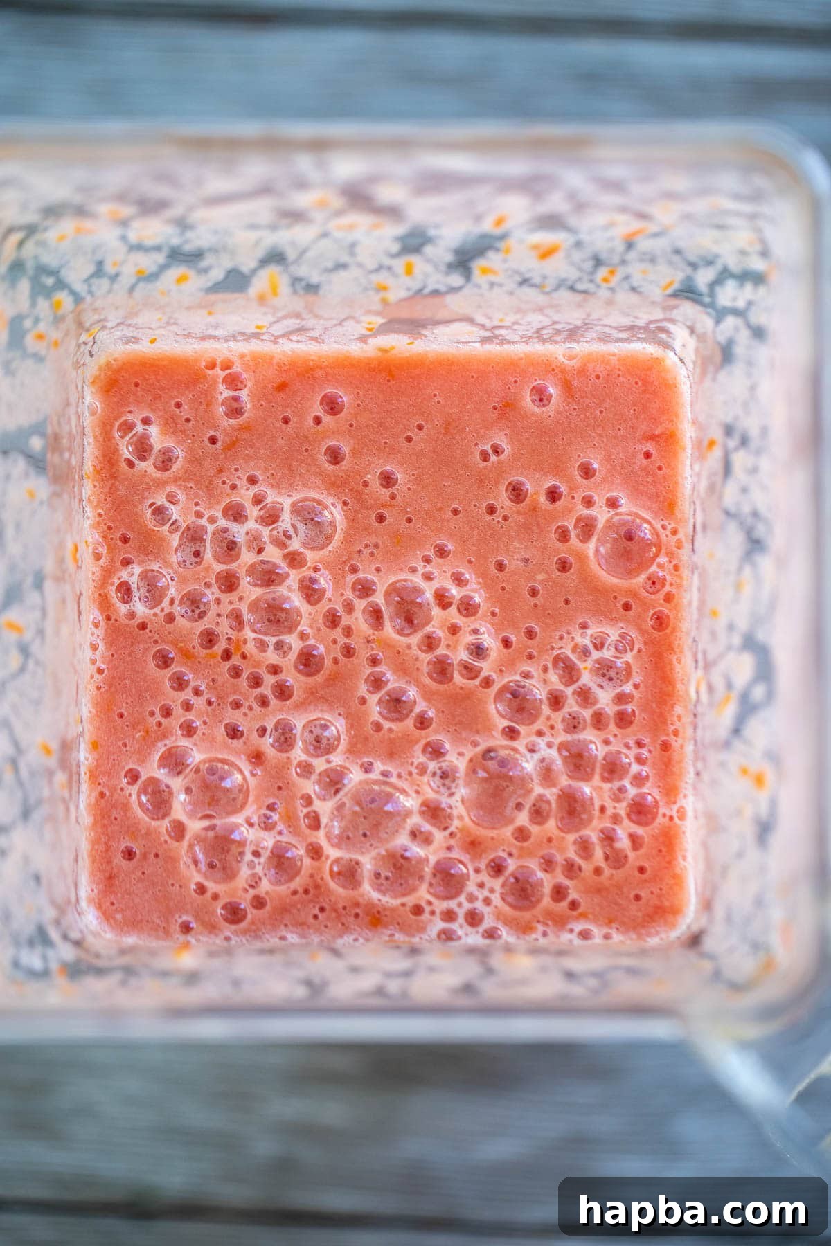 Artisan Homemade Tomato Paste 6 Bright red tomato puree swirling inside a blender, demonstrating the smooth consistency