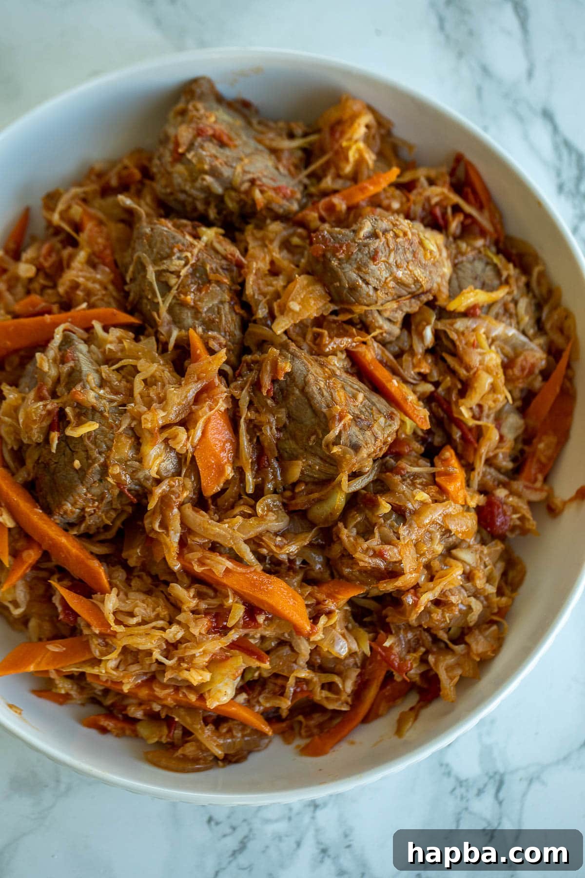 A bowl of rich and flavorful Cabbage and Beef Stew, ready to be enjoyed.