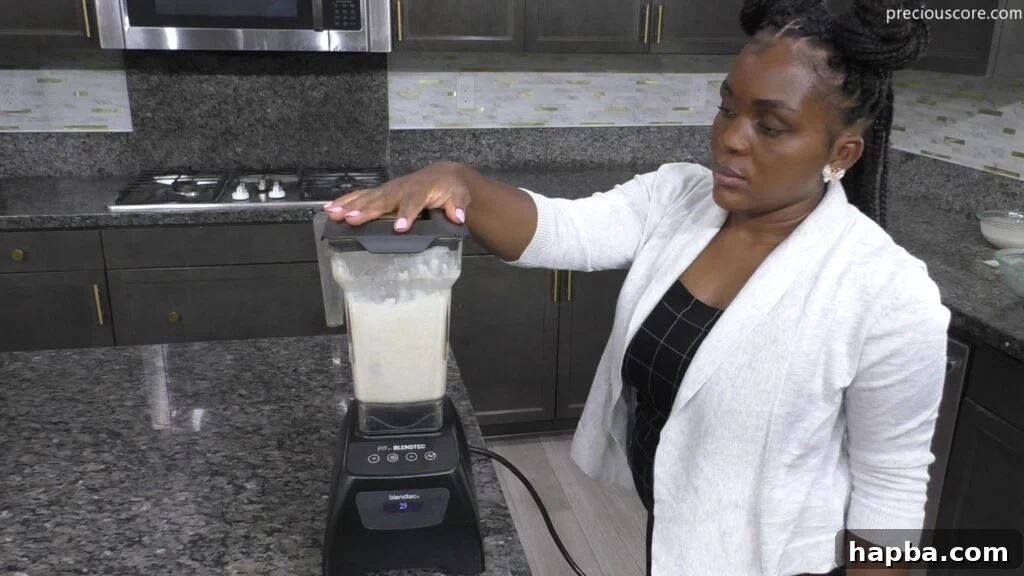 Fluffy East African Coconut Rice Pancakes 5 All ingredients for rice pancakes being blended together in a high-powered blender.