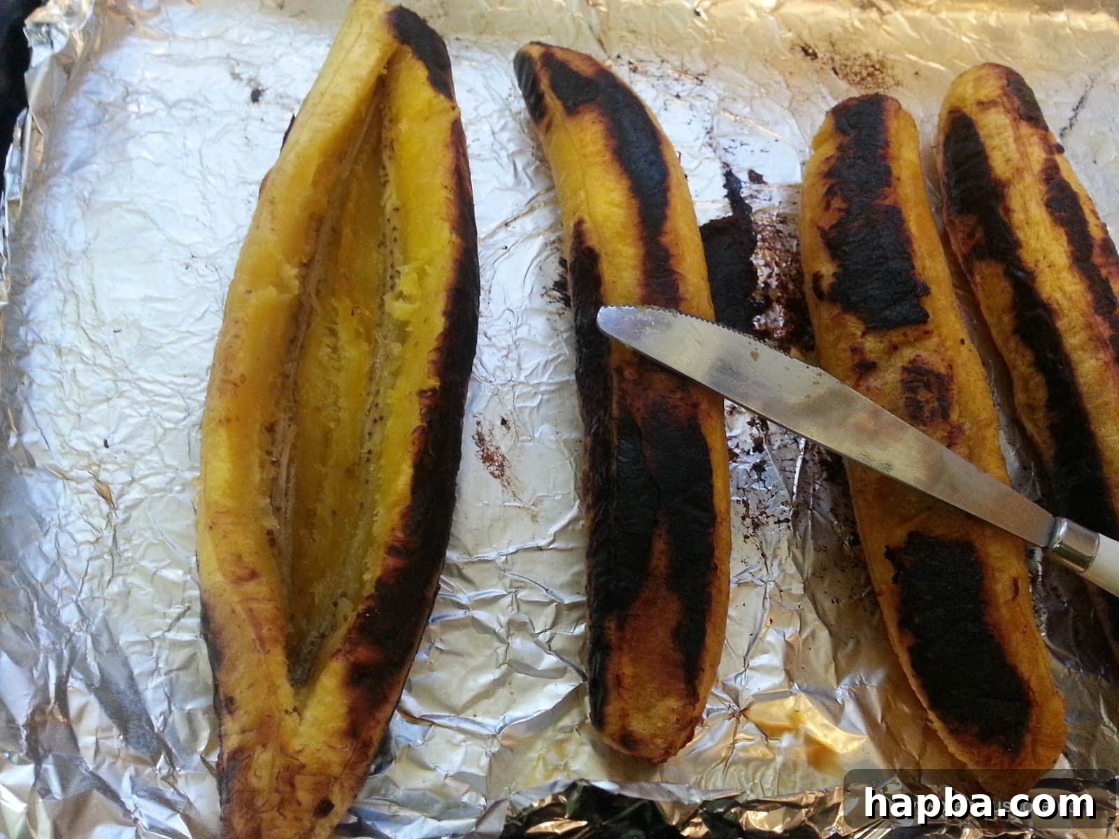 A roasted plantain carefully sliced lengthwise to create a pocket.