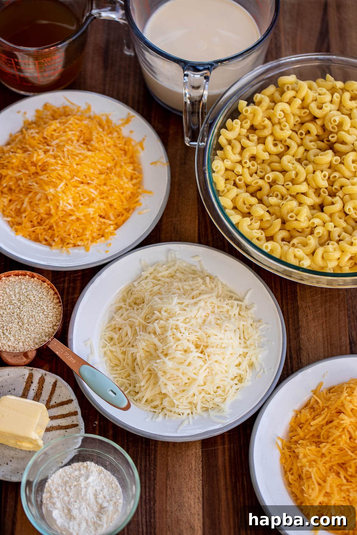 Creamy Triple Cheese Macaroni 3 Ingredients for 3 cheese mac and cheese on a chopping board