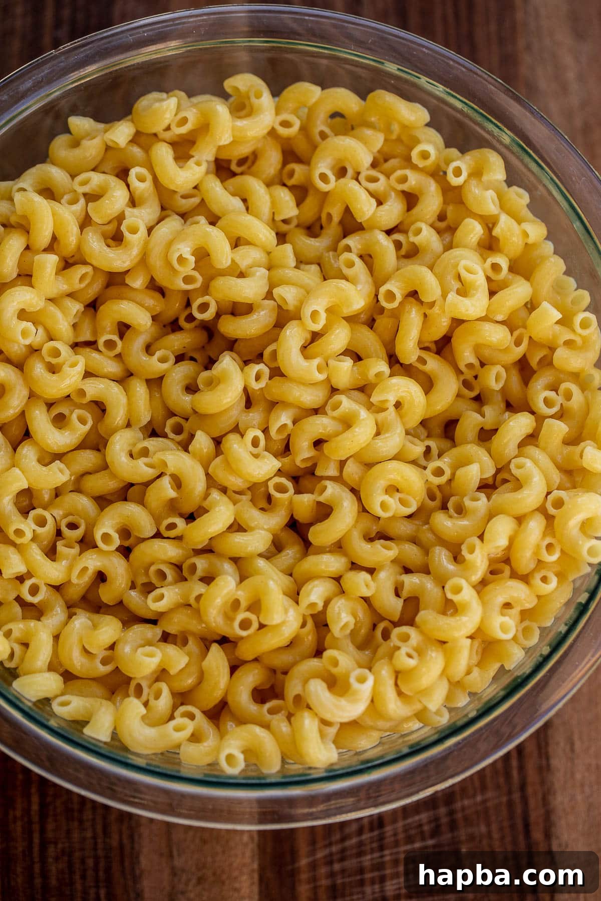 Creamy Triple Cheese Macaroni 4 Bowl of cooked macaroni tossed with butter