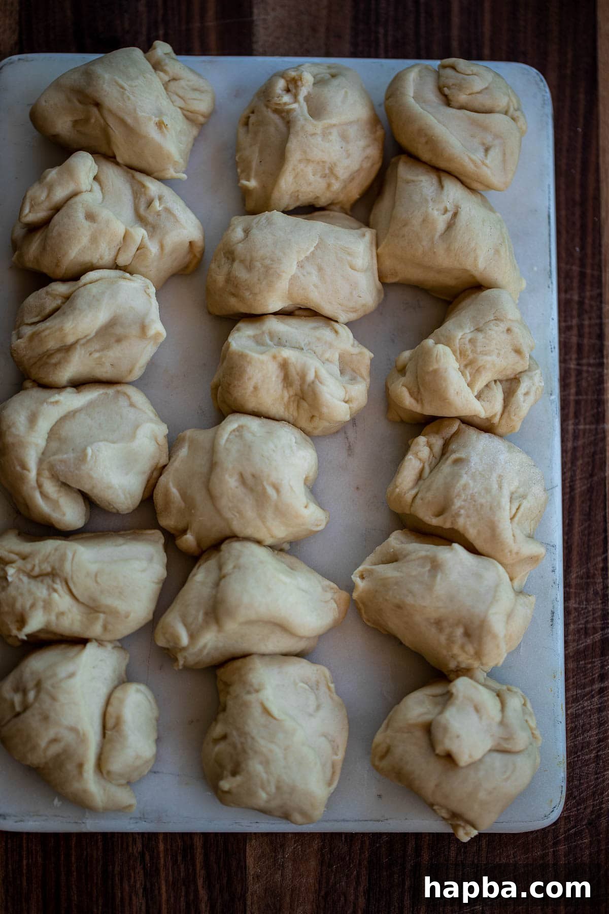 A ball of dough divided into 18 equal pieces, ready for shaping.