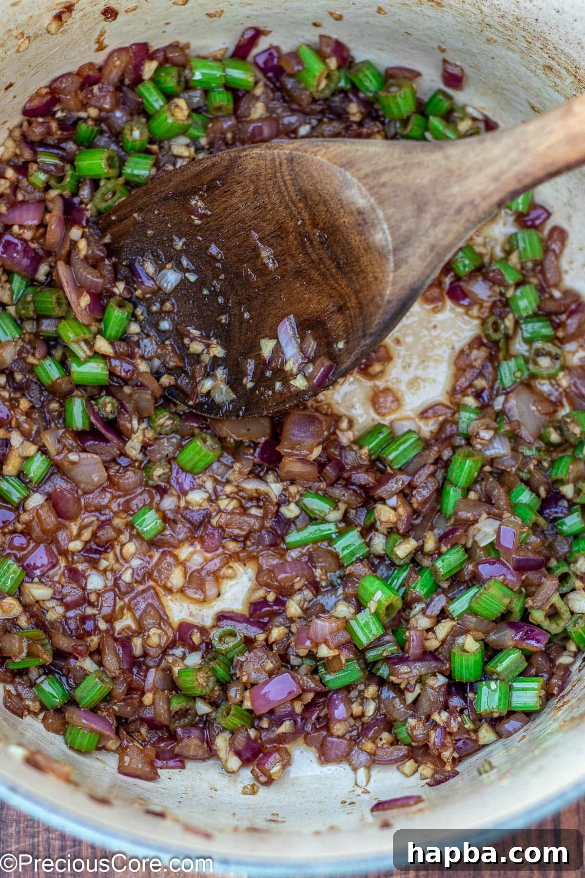 Non-Alcoholic Beef Stew 8 Diced onions and celery gently cooking in the Dutch oven, absorbing flavors.
