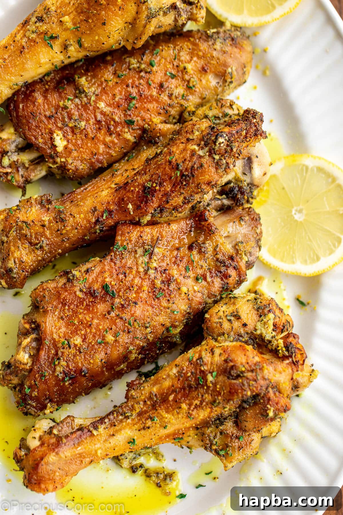 Lemon pepper turkey wings on a serving platter.