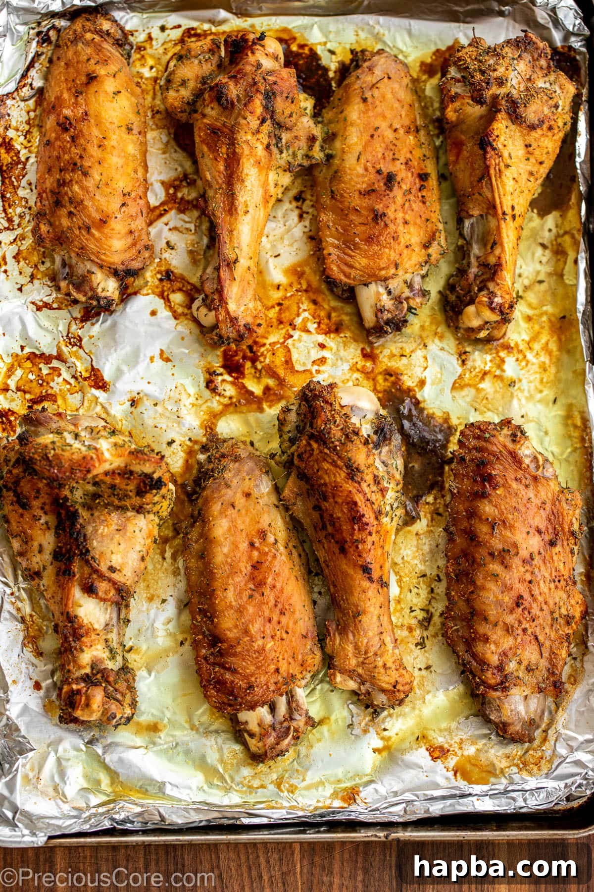 Roasted turkey wings on a baking sheet.
