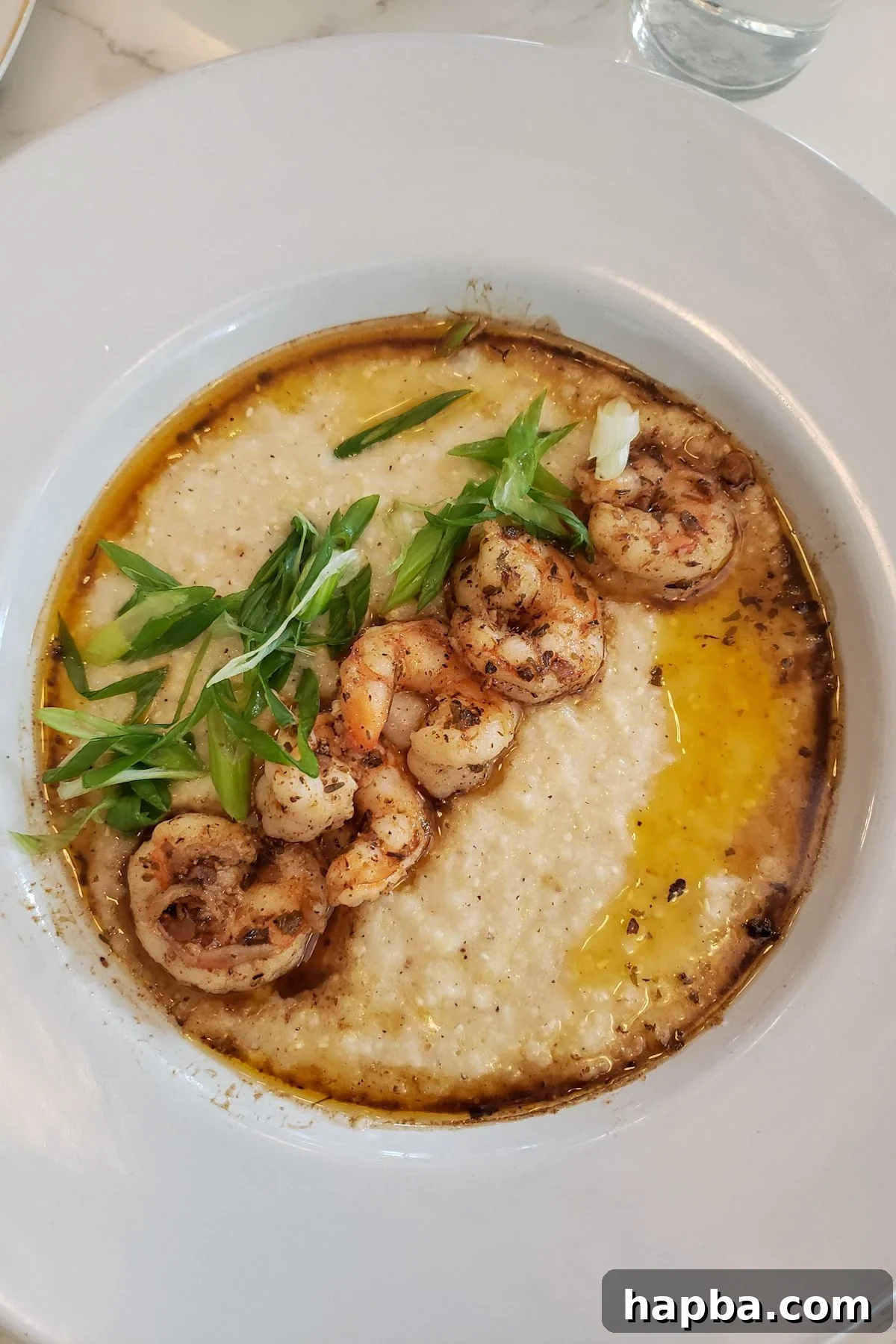 Austin Texas Family Adventure 4 A tantalizing plate of shrimp and grits, a classic Southern dish enjoyed at a restaurant in Austin, Texas.