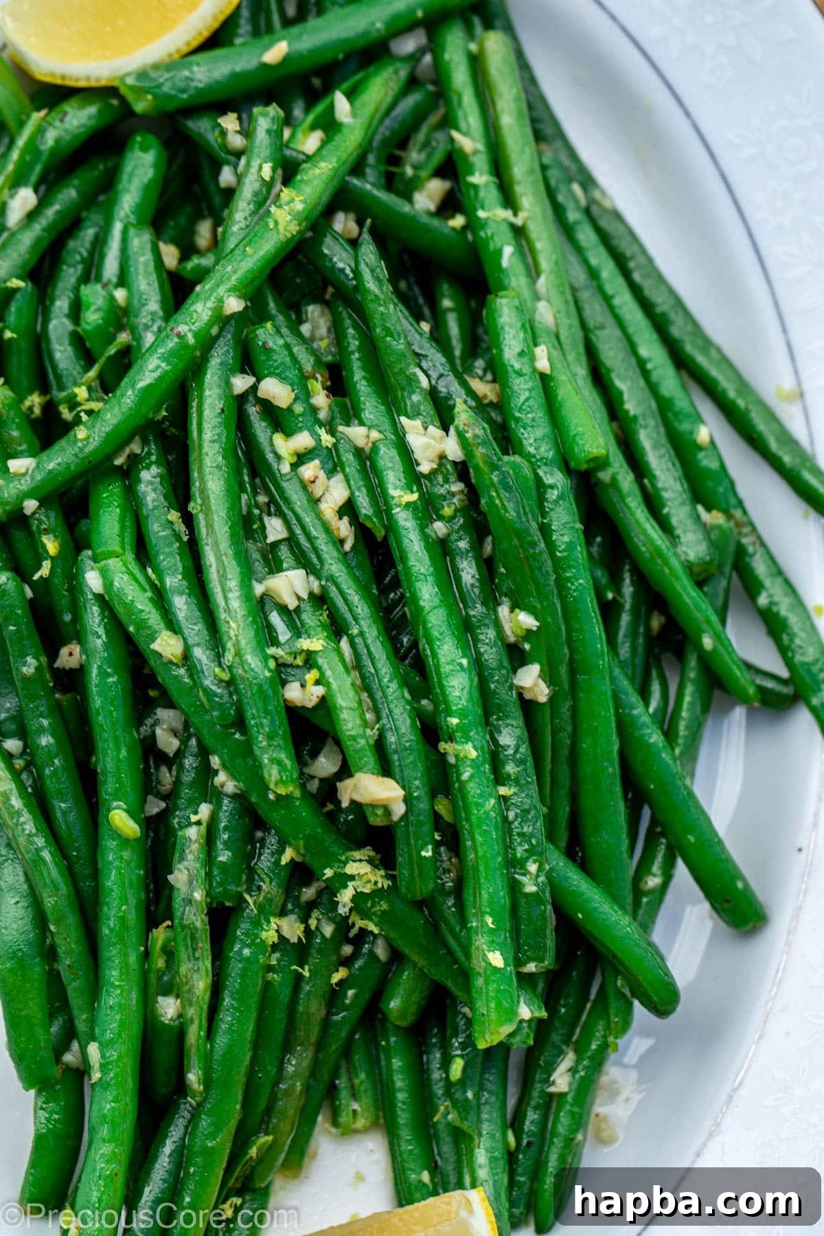 Cooked green beans on a elegant serving tray, ready for presentation.