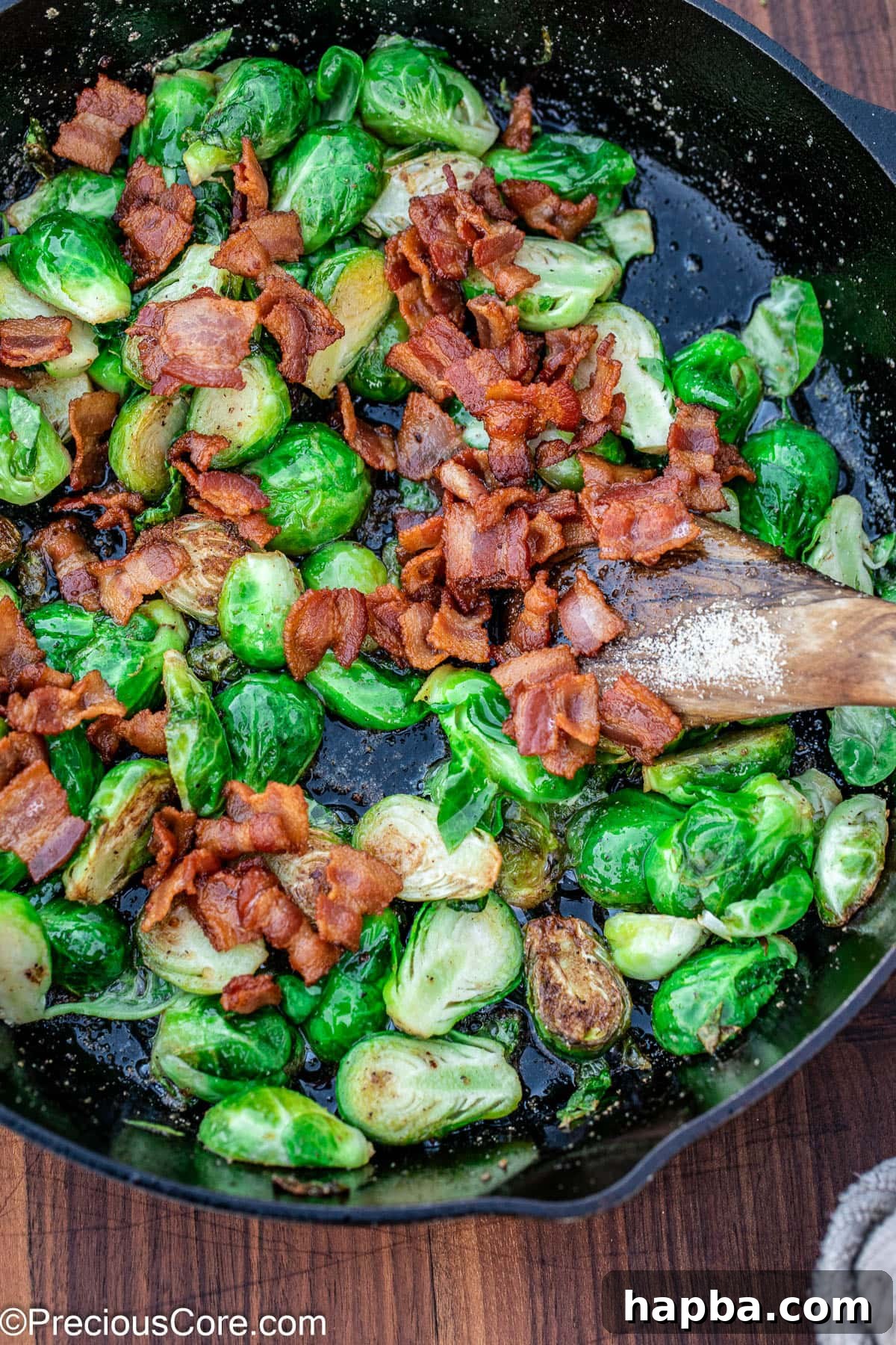 Caramelized Brussels Sprouts with Crispy Bacon 9 Pan fried Brussels sprouts in a skillet with bacon.