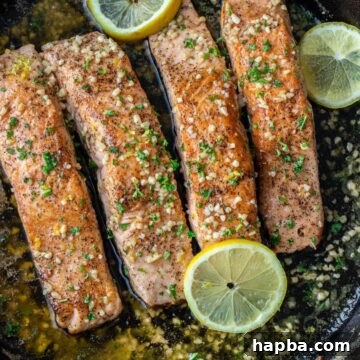 4 pieces of salmon in a cast iron skillet.