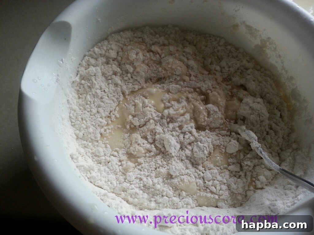 Wet ingredients added to dry ingredients for coconut pancakes