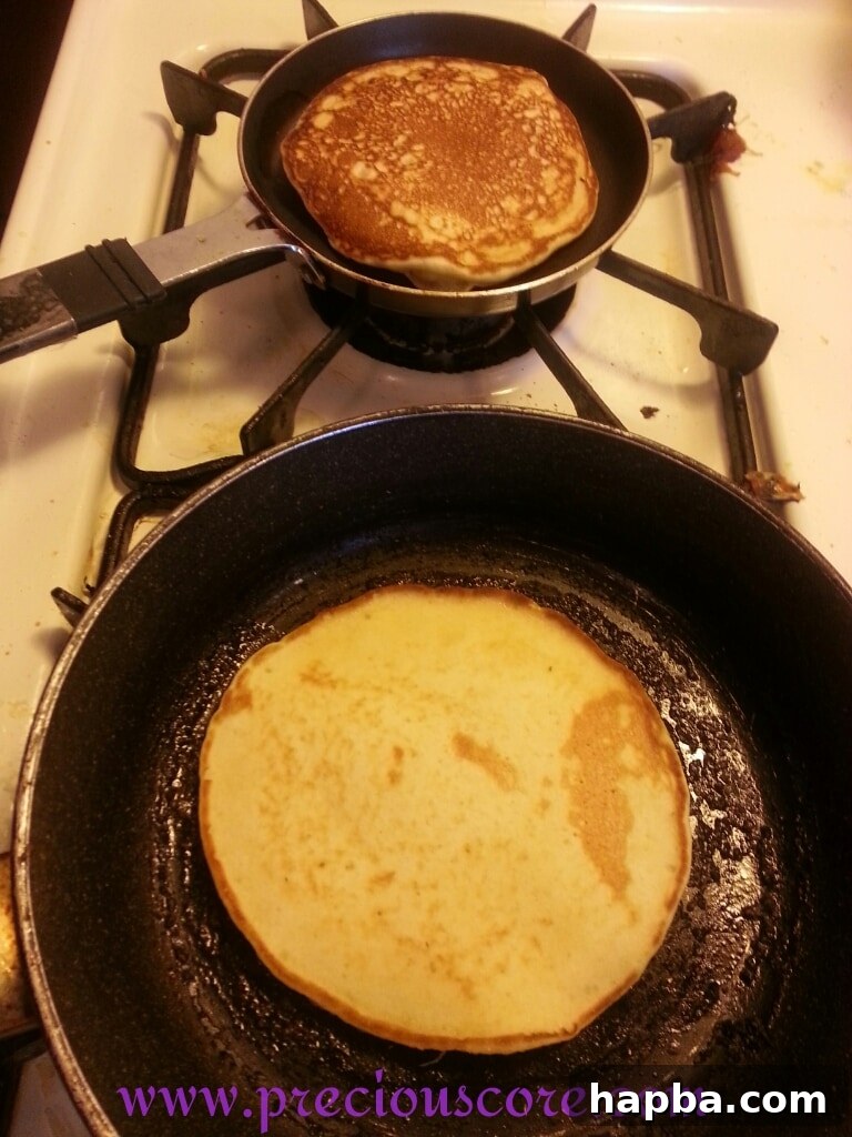 Cooked coconut pancakes stacked on a plate