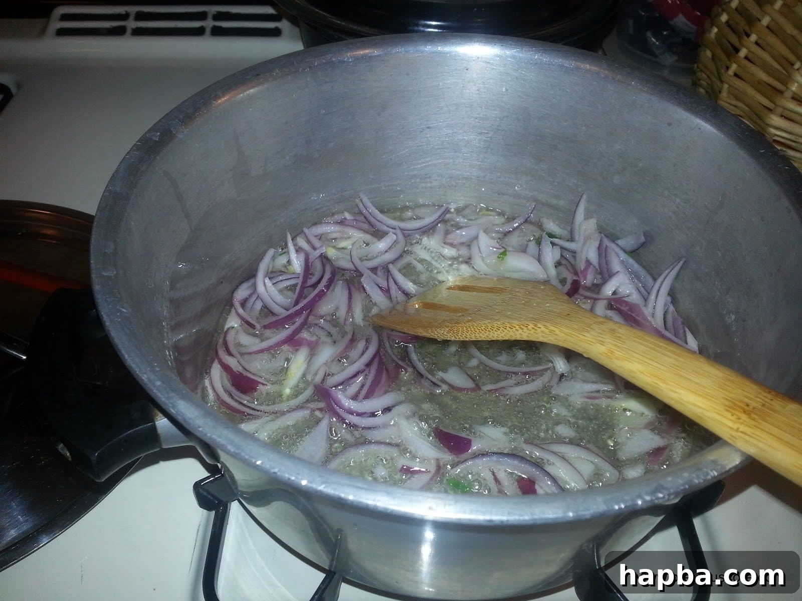Savory Cabbage and Vegetable Stir-Fry 10 Chopped onions sizzling in hot oil in a pot