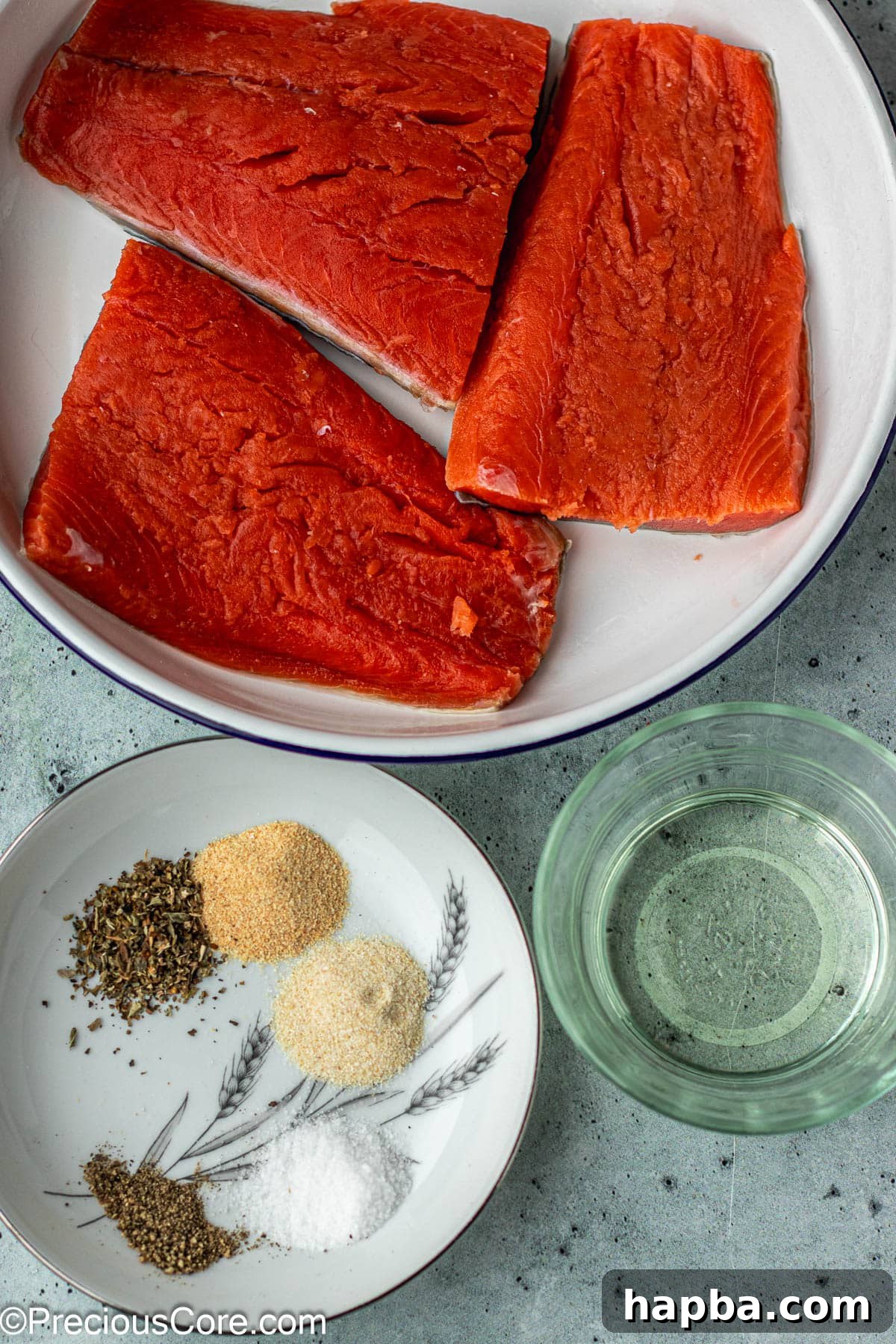 Crispy Salmon Bites 4 Fresh salmon fillet, olive oil, and a blend of spices laid out on a clean surface.