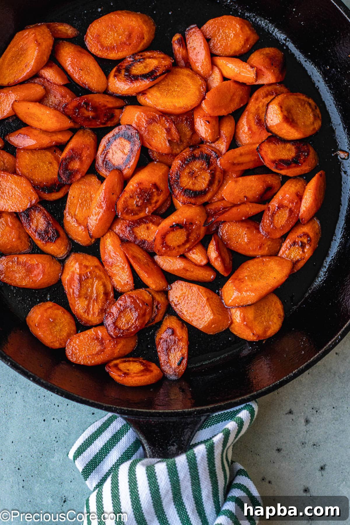 Caramelized Carrots 6 Perfectly cooked fried carrots, seasoned and ready to serve, still in the cast iron skillet.